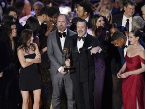 Jason Sudeikis, center, and the cast of "Ted Lasso" accept the Emmy for outstanding comedy series at the 74th Primetime Emmy Awards on Monday, Sept. 12, 2022, at the Microsoft Theater in Los Angeles.