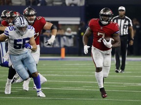 Dallas Cowboys linebacker Leighton Vander Esch (55) gives chase as Tampa Bay Buccaneers running back Leonard Fournette (7) runs the ball for a long gain in the second half of a NFL football game in Arlington, Texas, Sunday, Sept. 11, 2022.