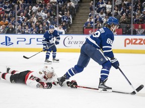 Toronto Maple Leafs right wing William Nylander (88) passes to Toronto Maple Leafs centre Denis Malgin (62) while Ottawa Senators defenceman Nikita Zaitsev (22) defends during second period NHL pre-season action in Toronto on Saturday, September 24, 2022.