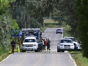 Emergency crews work the scene of a plane crash involving two planes along Niwot Road between N. 95th St. and Highway 287, Saturday, Sept. 17, 2022, in Longmont, Colo. Two small airplanes collided in mid-air Saturday near Denver, killing three people, authorities said.