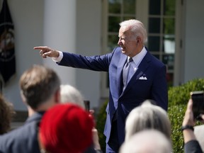President Joe Biden talks to people after speaking during an event on health care costs, in the Rose Garden of the White House, Tuesday, Sept. 27, 2022, in Washington.