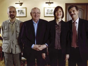 Associated Press staff members Sergei Fedotov, left, Lynn Berry and Vladimir Kondrashov, right, pose for a photo with Mikhail Gorbachev, second from left, on Nov. 27, 2008, after an interview at the Gorbachev Foundation in Moscow.
