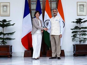 In this photo from Indian Foreign Minister S. Jaishankar's Twitter handle, Jaishankar shakes hand with French Foreign Minister Catherine Colonna in New Delhi, India, Wednesday, Sept. 14, 2022. India and France on Wednesday discussed the security situation in the Indo-Pacific region and the consequences of Russia's invasion of Ukraine, including concerns of food security and rising inflation, officials said. (Indian Foreign Minister S. Jaishankar's Twitter handle via AP)