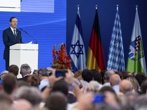 Israeli President Isaac Herzog delivers his speech during a ceremony to commemorate the victims of the attack by Palestinian militants on the 1972 Munich Olympics in Fuerstenfeldbruck near Munich, Germany, Monday, Sept. 5, 2002. The German and Israeli presidents are to join relatives of the 11 Israeli athletes killed in the attack by Palestinian militants on the commemoration event marking the 50th anniversary of the attack.