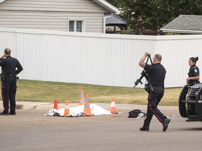 Police investigate the scene of a stabbing where one person was killed and two others injured in Edmonton, on Wednesday Sept. 7, 2022.