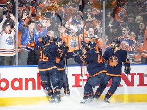 Edmonton Oilers' Dylan Holloway (36), Ryan Nugent-Hopkins (93), Zack Kassian (44) and Evan Bouchard (75) celebrate a goal against the Colorado Avalanche during second period NHL conference finals action in Edmonton on Monday, June 6, 2022. Holloway played in one NHL game last season.