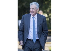 Federal Reserve Chair Jerome Powell smiles and walks after his speech at the central bank's annual symposium at Jackson Lake Lodge in Grand Teton National Park Friday, Aug. 26, 2022. in Moran, Wyo.