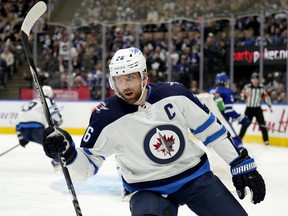 Winnipeg Jets right wing Blake Wheeler (26) celebrates his goal during first period NHL hockey action against the Toronto Maple Leafs, in Toronto, Thursday, March 31, 2022. The Jets have removed the "C" from Wheeler's jersey and will play the next NHL season without a captain.