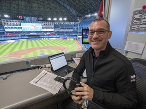 Toronto Blue Jays announcer Ben Wagner sits in the broadcast booth in Toronto, Sunday, April 10, 2022. When Toronto shortstop Bo Bichette snagged a liner in the ninth inning of Saturday's 4-3 win over the Texas Rangers, Blue Jays broadcaster Ben Wagner called the play with the energy of an observer who was clearly on the scene.