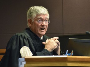 Montana District Judge Michael Moses speaks to attorneys during a court hearing on birth certificate changes for transgender people, on Sept 15, 2022, in Billings, Mont. Moses said in a Monday, Sept. 19, 2022, order that state health officials were being "demonstrably ridiculous" as they repeatedly refused to follow his orders to stop enforcing a state rule that would prevent transgender people from changing the gender on their birth certificate.