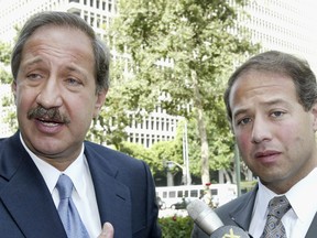 FILE - Attorneys Mark Geragos, left, and Brian Kabateck speak to the media outside the United States Federal Court building in Los Angeles, July 30, 2004, after a judge approved a multimillion-dollar settlement in a lawsuit for unpaid life insurance benefits filed by descendants of Armenians killed in the Turkish Ottoman Empire. The State Bar of California said Tuesday, Sept. 27, 2022, that it is investigating Geragos and Kabateck in connection with the spending of money in the United States and France from the settlement.