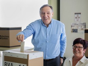 Coalition Avenir Quebec Leader Francois Legault casts his ballot ahead of the election during an election campaign stop in L'Assomption, Que., Sunday, Sept. 25, 2022. Quebecers will go to the polls on October 3rd.