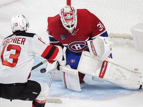 Montreal Canadiens goaltender Jake Allen stops New Jersey Devils' Nico Hischier during first period NHL pre-season hockey action in Montreal on Monday September 26, 2022.