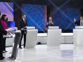From left, CAQ Leader Francois Legault, Liberal Leader Dominique Anglade, Parti Quebecois Leader Paul St-Pierre Plamondon, Quebec Solidaire co-spokesperson Gabriel Nadeau-Dubois and Conservative Leader Eric Duhaime participate in a leaders debate in Montreal, Thursday, Sept. 22, 2022. Quebecers will go to the polls on October 3rd.