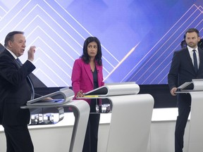 CAQ Leader Francois Legault gestures toward Liberal Leader Dominique Anglade and Parti Quebecois Leader Paul St-Pierre Plamondon during a leaders debate in Montreal, Thursday, Sept. 22, 2022. Quebecers go to the polls on October 3rd.