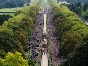 The Ceremonial Procession of the coffin of Queen Elizabeth II travels down the Long Walk as it arrives at Windsor Castle for the Committal Service at St. George’s Chapel on September 19, 2022.