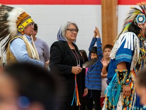 Governor General of Canada Mary Simon, middle, joins dancers during a visit to Bernard Constant Community School at James Smith Cree Nation, Sask., on Wednesday, Sept. 28, 2022. Simon is to be among those speaking at a Truth and Reconciliation event in Regina today.