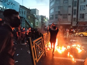 Demonstrators during a protest in Tehran for Mahsa Amini on September 21. Source: AFP/Getty Images