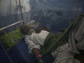 A man suffering from dengue fever, a mosquito-borne disease, is treated at a hospital, in Peshawar, Pakistan, Friday, Sept. 16, 2022. Pakistani health officials are battling an outbreak of dengue fever in several parts of the country following the devastating floods, which have affected more than 33 million people and displaced more than 5 million people who are still living in tents and shelters.