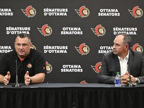Ottawa Senators head coach D.J. Smith, left, and general manager Pierre Dorion participate in a news conference as the team begins its training camp in Ottawa, on Wednesday, Sept. 21, 2022.