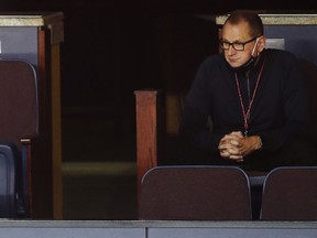 Calgary Flames general manager Brad Treliving watches the action during a team scrimmage game in Calgary, Alta., Friday, July 24, 2020 Treliving is as anxious as any Flames fan to see if his efforts replaced what was lost.&ampnbsp;THE CANADIAN PRESS/Jeff McIntosh