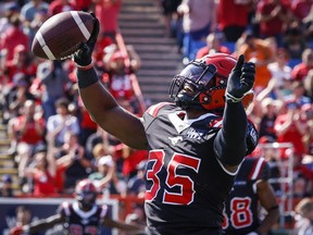 Calgary Stampeders running back Ka'Deem Carey celebrates his touchdown during first half CFL football action against the Edmonton Elks in Calgary, Alta., Monday, Sept. 5, 2022.