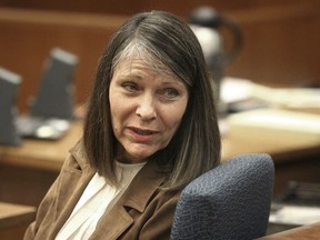 FILE - Dana Chandler is seen in court before opening arguments, Thursday, March 8, 2012, in Topeka, Kan. Chandler, a Topeka woman, was charged with two counts of premeditated first-degree murder in the July 7, 2002, slayings of her ex-husband, 47-year-old Mike Sisco, and 53-year-old Karen Harkness. Her convictions for killing the couple 20 years ago were overturned because of prosecutorial misconduct, but she is now back before jurors in Kansas, still maintaining she was miles away in Colorado when the deaths occurred.