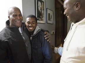 FILE - Malcolm Alexander, left, 58, was roughly the same age as his grandson son Malcolm Stewart, Jr., 20, center, next to his son Malcolm Stewart before a press conference shortly after his release in New Orleans, La., on Jan. 30, 2018. Alexander, a Louisiana man imprisoned for nearly four decades until conviction in a 1979 rape was thrown out in 2018, is now fighting for compensation for being wrongfully convicted. The Times-Picayune/The New Orleans Advocate reports that attorneys for Alexander took his argument for compensation to a state appeals court on Thursday, Sept. 8, 2022.