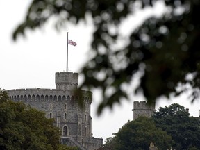 The British flag flies at half mast at Windsor Castle, Berkshire, following Thursday's death of Queen Elizabeth II, Friday Sept. 9, 2022. Queen Elizabeth II, Britain's longest-reigning monarch and a rock of stability across much of a turbulent century, died Thursday at the age of 96 after 70 years on the throne.
