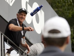 LIV Golf CEO Greg Norman tosses beer to fans on the 18th green during the final round of the LIV Golf Invitational-Boston tournament, Sunday, Sept. 4, 2022, in Bolton, Mass.