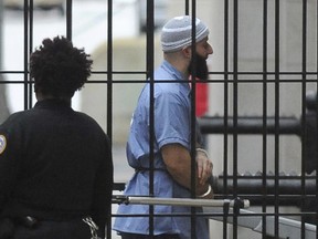 FILE - Adnan Syed enters Courthouse East prior to a hearing on Feb. 3, 2016, in Baltimore. Baltimore prosecutors asked a judge on Wednesday, Sept. 14, 2022, to vacate Syed's conviction for the 1999 murder of Hae Min Lee -- a case that was chronicled in the hit podcast "Serial".