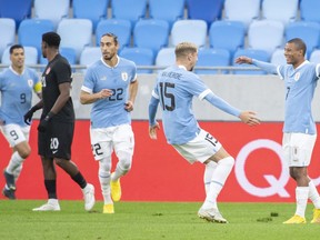 Uruguay players celebrate after scoring a goal during the international friendly soccer match between Canada and Uruguay in Bratislava, Slovakia, Tuesday, Sept. 27, 2022.
