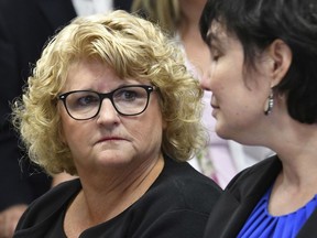 FILE - In this Sept. 27, 2018 file photo, Kathie Klages, left, former MSU women's gymnastics coach, looks at her attorney, Mary Chartier in court in Lansing, Mich. The Michigan Supreme Court turned down an appeal Wednesday, Sept. 21, 2022, and won't reinstate the conviction of Klages, a retired Michigan State University gymnastics coach who was accused of lying to investigators about campus sports doctor Larry Nassar.