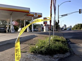 Crime scene tape blows in the wind on Monday, Sept. 12, 2022, near the scene in the 2800 block of North Florissant Avenue where St. Louis police say they shot and killed Black teenager Darryl Ross, 16, Sunday night in the city's Old North St. Louis neighborhood.