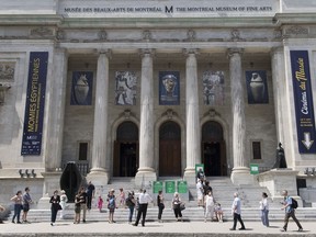 People wait to enter the Museum of Fine Arts in Montreal, Saturday, June 6, 2020.