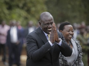 Kenya's President-Elect William Ruto gestures to party officials as he walks with his wife Rachel Ruto as he prepares to address the media at his official residence in Nairobi, Kenya Monday, Sept. 5, 2022. Kenya's Supreme Court on Monday unanimously rejected challenges to the official results of the presidential election and upheld William Ruto's narrow win in East Africa's most stable democracy.