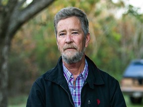 FILE - Leslie McCrae Dowless Jr. poses for a portrait outside of his home on Dec. 5, 2018, in Bladenboro, N.C. Four people pled guilty Monday, Sept. 26, 2022, to misdemeanors for their roles in absentee ballot fraud in rural North Carolina during the 2016 and 2018 elections. The defendants were associated with Dowless, a political operative in Bladen County whom authorities called the ringleader of the ballot scheme. Dowless died earlier in 2022 before his case went to trial.