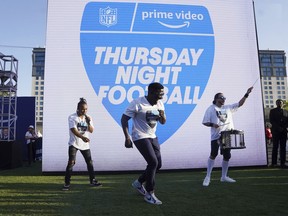 FILE - Robert "Bojo" Ackah, center, and Fik-Shun, left, perform during the announcement of the first Thursday Night Football on Prime Video matchup featuring the San Diego Chargers at Kansas City Chiefs at the 2022 NFL Draft on Thursday, April 28, 2022 in Las Vegas. The Thursday night, Sept. 15 game between the Los Angeles Chargers and Kansas City Chiefs kicks off Amazon Prime Video's 11-year agreement with the NFL to carry "Thursday Night Football".