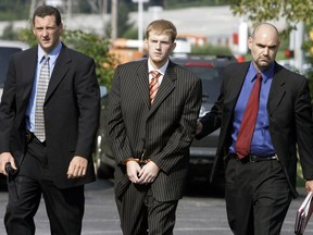FILE - In this Aug. 29, 2007, file photo, Britt Reid is escorted into the Montgomery County district court house in Conshohocken, Pa. Former Kansas City Chiefs assistant coach Britt Reid is scheduled to enter a guilty plea to felony driving while intoxicated related to a car crash that seriously injured a young girl. Jackson County Circuit Court online records show Reid, the son of Chiefs coach Andy Reid, is scheduled to plead guilty on Monday, Sept. 12, 2022.