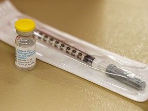 FILE - A vial containing the monkeypox vaccine and a syringe is set on the table at a vaccination clinic run by the Mecklenburg County Public Health Department in Charlotte, N.C., Saturday, Aug. 20, 2022. In the wake of a study released on Thursday, Sept. 8, 2022, U.S. officials are considering broadening recommendations for who gets vaccinated against monkeypox, possibly to include many men being treated for HIV or those who recently had other sexually transmitted infections.