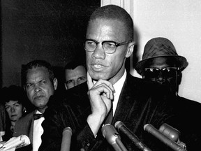 FILE - Malcolm X speaks to reporters in Washington on May 16, 1963. Fifteen years after being rejected as too controversial, Malcolm X has been inducted as the newest member of the Nebraska Hall of Fame. The organization's commission selected the civil rights icon on Monday, Sept. 12, 2022, on a 4-3 vote. (AP Photo, File)