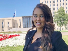 FILE - Cara Mund poses for a photo in front of the state Capitol in Bismarck, N.D. on Aug. 10, 2022. Mund's entry into North Dakota's U.S. House race has led Democrat Mark Haugen to drop out Sunday, Sept. 4, 2022, citing pressure from his own party to step aside. Mund entered the race in August as an independent, citing her support for abortion rights as a major reason.