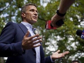 FILE - Former Missouri Gov. Eric Greitens speaks to reporters after voting in Missouri's primary election on Aug. 2, 2022, in Innsbrook, Mo. The Associated Press has joined The Kansas City Star's motion to get a sealed court record from former Missouri Gov. Eric Greitens' child custody case. The AP's motion was filed Thursday, Sept. 1, 2022, and was accepted by the court clerk Tuesday.