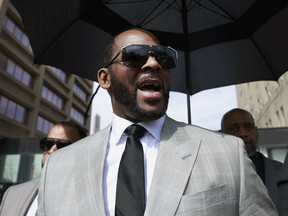 FILE - R&B singer R. Kelly leaves the Leighton Criminal Court building in Chicago on June 6, 2019. R. Kelly's musical accomplishments have been accompanied by a long history of allegations that he sexually abused women and children. Now the R&B singer faces a jury verdict in Chicago on charges of child pornography and obstruction of justice. Born Robert Sylvester Kelly, he has vehemently denied the allegations.
