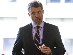 Frederik, Crown Prince of Denmark tries an alternative version to a cookie with dried crickets on it at a sustainable food conference on the High Line on Tuesday, Sept. 20, 2022, in New York.