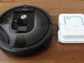 FILE - In this Thursday, Aug. 25, 2016, photo, an iRobot Roomba vacuum, left, and Braava Jet floor cleaner are displayed at the company's headquarters in Bedford, Mass. The Federal Trade Commission is investigating Amazon's $1.7 billion acquisition of iRobot. In a regulatory filing Tuesday, Sept. 20, 2022, iRobot said both it and Amazon received a request for additional information in connection with an FTC review of the merger.