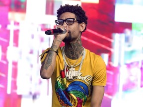 FILE - PnB Rock performs on Day 3 of the 2018 Firefly Music Festival at The Woodlands on June 16, 2018, in Dover, Del. The Philadelphia rapper was fatally shot Monday, Sept. 12, 2022, during a robbery in South Los Angeles, according to police and media reports.