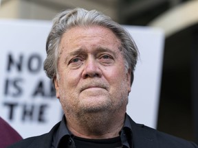 Former White House strategist Steve Bannon pauses as he departs federal court July 22, 2022, in Washington. Bannon, a longtime ally of former President Donald Trump, said Tuesday, Sept. 6, that he expects to be charged soon in a state criminal case in New York. Bannon, 68, plans to turn himself in on Thursday, according to a person familiar with the matter. The person insisted on anonymity to discuss an ongoing investigation.