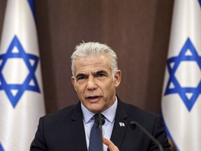 Israel's Prime Minister Yair Lapid attends the weekly cabinet meeting in Jerusalem, on Sept. 18, 2022. Israel's prime minister on Monday, Sept. 19, 2022 vowed to begin production at a contested Mediterranean natural gas field "as soon as it is possible," threatening to raise tensions with Lebanon's Hezbollah militant group.