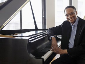 FILE - Jazz pianist and composer Ramsey Lewis describes his composing methods during an interview at his home in Chicago, April 5, 2011. Renowned jazz pianist Lewis, whose music entertained fans over a more than 60-year career that began with the Ramsey Lewis Trio and made him one of the country's most successful jazz musicians, died Monday, Sept. 12, 2022. He was 87.